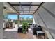 Outdoor kitchen with seating area, perfect for backyard entertaining at 8498 Powder Ridge Trl, Windermere, FL 34786