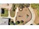 Aerial view of a community playground with a variety of equipment and seating at 8498 Powder Ridge Trl, Windermere, FL 34786
