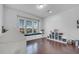 Bright playroom featuring hardwood floors, a window seat with storage, and plenty of room to play at 8498 Powder Ridge Trl, Windermere, FL 34786