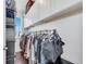 Organized walk-in closet with ample storage and natural light from the window at 8498 Powder Ridge Trl, Windermere, FL 34786