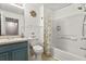 Well-maintained bathroom featuring tiled shower-tub combo and vanity with coordinated decor at 8534 Crystal Cove Loop, Kissimmee, FL 34747