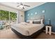 Bright and airy bedroom with balcony, decorated with nautical decor, and equipped with ceiling fan at 8534 Crystal Cove Loop, Kissimmee, FL 34747