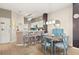 Open concept dining area with a table and chairs adjacent to the kitchen at 8534 Crystal Cove Loop, Kissimmee, FL 34747