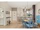 Open concept dining area with a table and chairs adjacent to the kitchen at 8534 Crystal Cove Loop, Kissimmee, FL 34747
