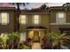 Charming townhouse with a stucco facade, red tile roof, and well-manicured landscaping at 8534 Crystal Cove Loop, Kissimmee, FL 34747
