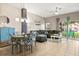 Open living room with a couch, table, and bright windows at 8534 Crystal Cove Loop, Kissimmee, FL 34747