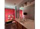 Bathroom featuring a vanity, a mirror, and a red shower curtain with Disney characters at 8631 La Isla Dr, Kissimmee, FL 34747