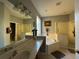 Bright bathroom featuring double sinks, a tub, a separate shower and neutral-toned walls at 8631 La Isla Dr, Kissimmee, FL 34747