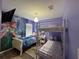 Bright bedroom with custom wall art, a bunk bed, and playful decor at 8631 La Isla Dr, Kissimmee, FL 34747
