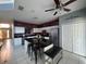 Open kitchen featuring a large island, stainless steel appliances, and tile flooring at 8631 La Isla Dr, Kissimmee, FL 34747