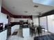 Modern kitchen with white cabinets, stainless steel appliances, and a large island at 8631 La Isla Dr, Kissimmee, FL 34747
