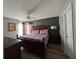 Comfortable main bedroom featuring wood floors, a ceiling fan, and soft lighting at 8631 La Isla Dr, Kissimmee, FL 34747