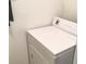 Close up of a white clothes dryer in the laundry area at 8817 Dunes Ct # 8-303, Kissimmee, FL 34747