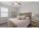 Comfortable bedroom featuring soft bedding, stylish decor, and natural light at 8999 Croquet Ct, Davenport, FL 33896