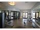 Community gym filled with weight machines and equipment with doors leading to exterior at 8999 Croquet Ct, Davenport, FL 33896