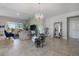 Staged Living Room with modern decor, a striking chandelier, and plenty of natural light at 8999 Croquet Ct, Davenport, FL 33896