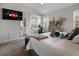 Bright main bedroom with neutral walls, plush carpet, and a television for cozy movie nights at 8999 Croquet Ct, Davenport, FL 33896
