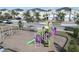 Community playground with swings, climbing structures and slides, perfect for play and outdoor fun at 8999 Croquet Ct, Davenport, FL 33896