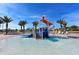 Community water park featuring splash pad with slides and playground in a tropical landscape setting at 8999 Croquet Ct, Davenport, FL 33896