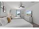 Inviting bedroom with two beds, a dresser, and a mounted TV, perfect for guests or Gathering at 9190 Sommerset Hills Dr, Davenport, FL 33896