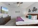 Stylish bedroom features a plush bed, dresser, and mounted TV for relaxation at 9190 Sommerset Hills Dr, Davenport, FL 33896