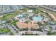 Aerial shot of community featuring lush landscaping, multiple pools, splashpads, and clubhouse at 9190 Sommerset Hills Dr, Davenport, FL 33896