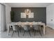 A beautifully staged dining room features a modern chandelier and seating for six at 9190 Sommerset Hills Dr, Davenport, FL 33896