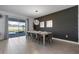 The dining room features a modern chandelier and sliding glass doors to the backyard at 9190 Sommerset Hills Dr, Davenport, FL 33896