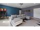 A finished game room offers a ping pong table, basketball hoop, and comfortable seating at 9190 Sommerset Hills Dr, Davenport, FL 33896