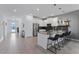 Contemporary kitchen with stainless steel appliances, sleek cabinetry, and breakfast bar seating at 9190 Sommerset Hills Dr, Davenport, FL 33896