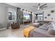 Bright living room with large windows, modern decor, and comfortable seating area at 9190 Sommerset Hills Dr, Davenport, FL 33896
