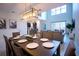 Bright dining area with an open-concept layout to the kitchen and living space at 1025 Leader St, Davenport, FL 33896