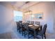 Dining room featuring a modern light fixture and seating for eight at the table at 1025 Leader St, Davenport, FL 33896
