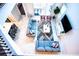 Bright living area with gray sofas, an area rug, and sliding glass doors from above at 1025 Leader St, Davenport, FL 33896