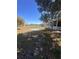 Large backyard with covered patio and chain link fence at 1149 E Grove Ave, Lake Wales, FL 33853