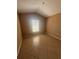 Bedroom featuring tile flooring and a window with natural light at 1149 E Grove Ave, Lake Wales, FL 33853
