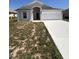 Lovely single-story home featuring an attached two-car garage and inviting entrance at 1149 E Grove Ave, Lake Wales, FL 33853