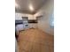 Bright kitchen with white cabinets, tile backsplash, and modern appliances at 1149 E Grove Ave, Lake Wales, FL 33853