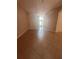 Neutral living room featuring tile flooring, a wall cutout, and natural light at 1149 E Grove Ave, Lake Wales, FL 33853