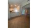 Open-concept living space with open view into the kitchen and access to additional rooms at 1149 E Grove Ave, Lake Wales, FL 33853