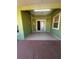 Enclosed patio with tile flooring, slider door, and accent lighting at 1149 E Grove Ave, Lake Wales, FL 33853