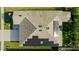 Aerial view of a home with solar panels, asphalt shingles, and a well-maintained lawn at 1153 Augustus Dr, Davenport, FL 33896
