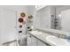 Clean bathroom featuring double sinks, granite countertops, and a tiled shower at 1153 Augustus Dr, Davenport, FL 33896