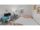 Bedroom featuring a work desk and a bed adorned with decorative pillows, illuminated by natural light at 1153 Augustus Dr, Davenport, FL 33896