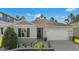 Charming single-story home with a well-manicured lawn and attached two-car garage at 1153 Augustus Dr, Davenport, FL 33896