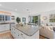 Open-concept kitchen featuring a large island, granite countertops, and stainless steel appliances at 1153 Augustus Dr, Davenport, FL 33896