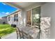 Outdoor patio featuring sliding door to indoors, wood table and chairs, and view of the yard at 1153 Augustus Dr, Davenport, FL 33896