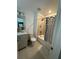 Cozy bathroom with shower, tub and vanity sink with updated fixture at 12673 Yoshino Aly, Orlando, FL 32827