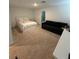 Large main bedroom featuring a bed, couch and doorway to the ensuite bathroom at 12673 Yoshino Aly, Orlando, FL 32827
