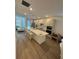 Bright, open kitchen features a large island with seating and modern appliances at 12673 Yoshino Aly, Orlando, FL 32827